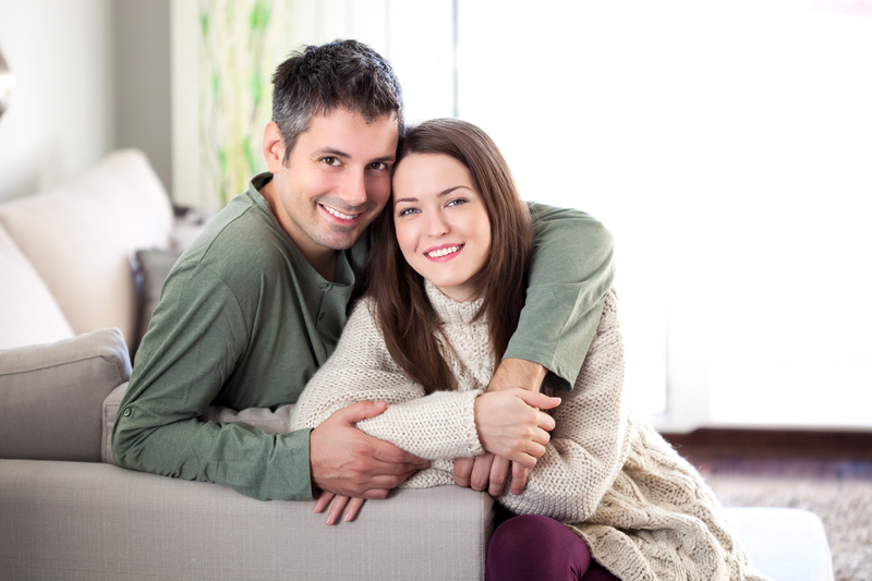 A man hugging his female partner