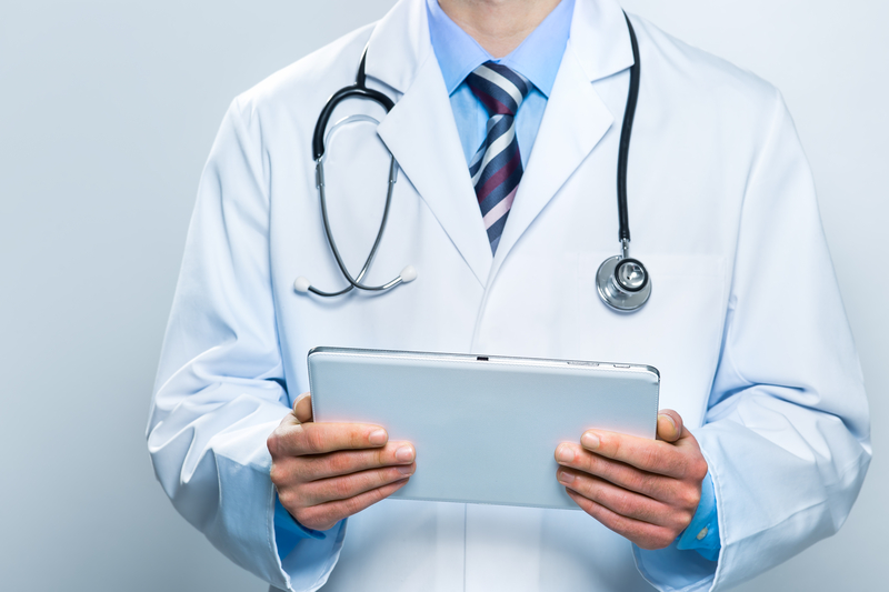 Fertility specialist holding a tablet