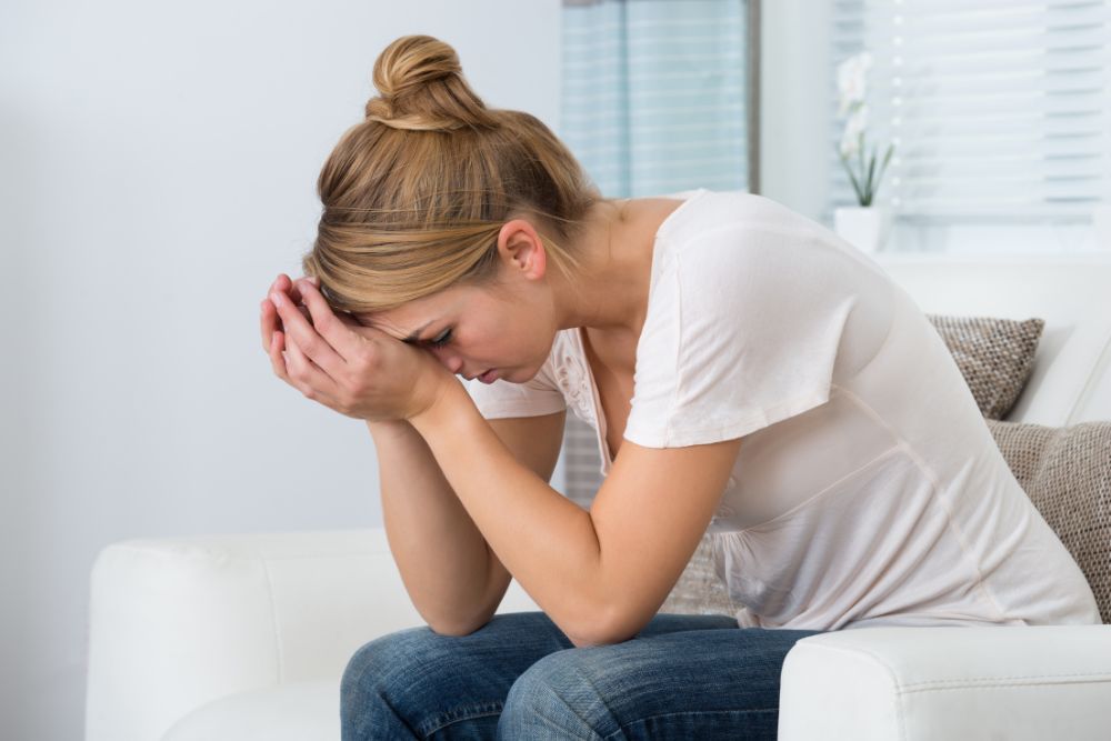 A female suffering from stress regarding her fertility