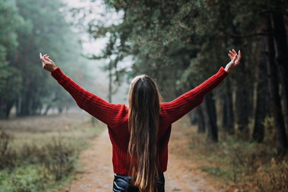 A female embracing nature