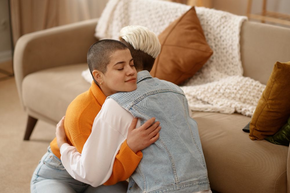 Couple hugging each other on the floor