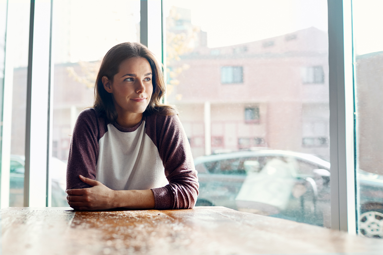 female sitting at a table