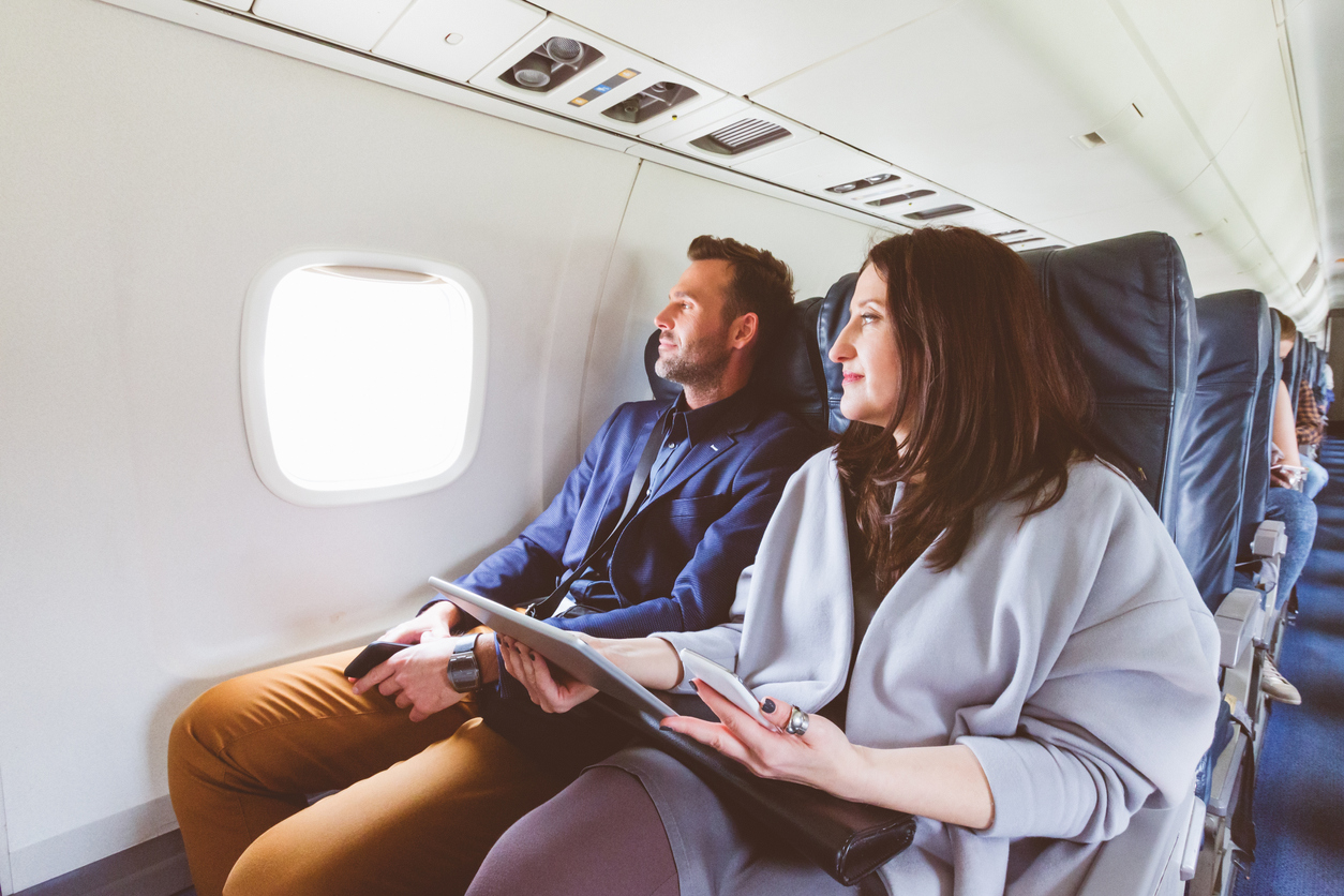 A couple sitting on an airplane