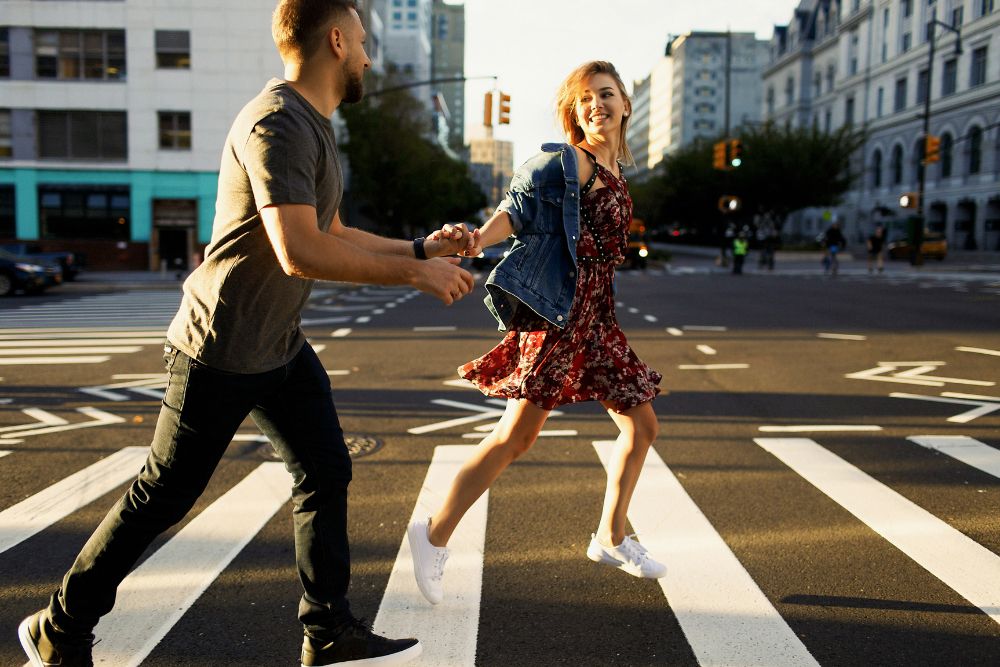 Couple walking on a crosswalk