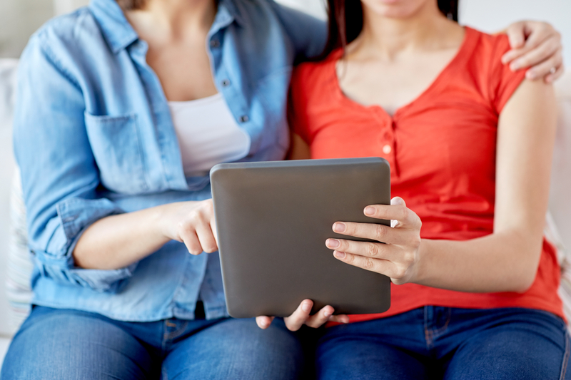 Two females looking at a tablet