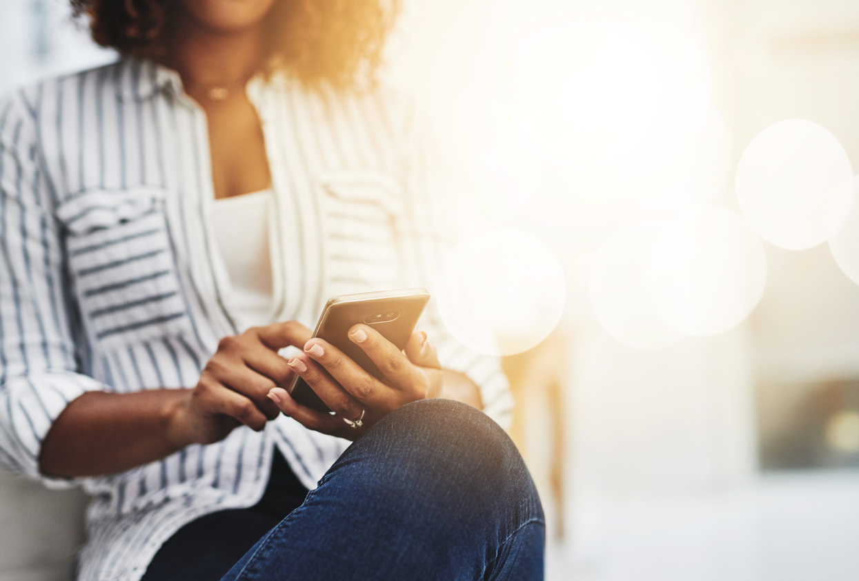 Lady scrolling through her mobile phone