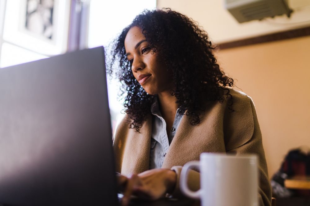 Female typing on her laptop