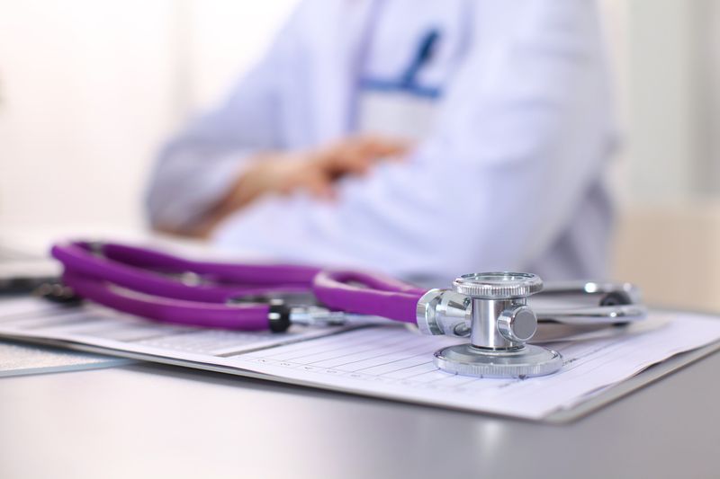 A health clipboard with a stethoscope on top of it